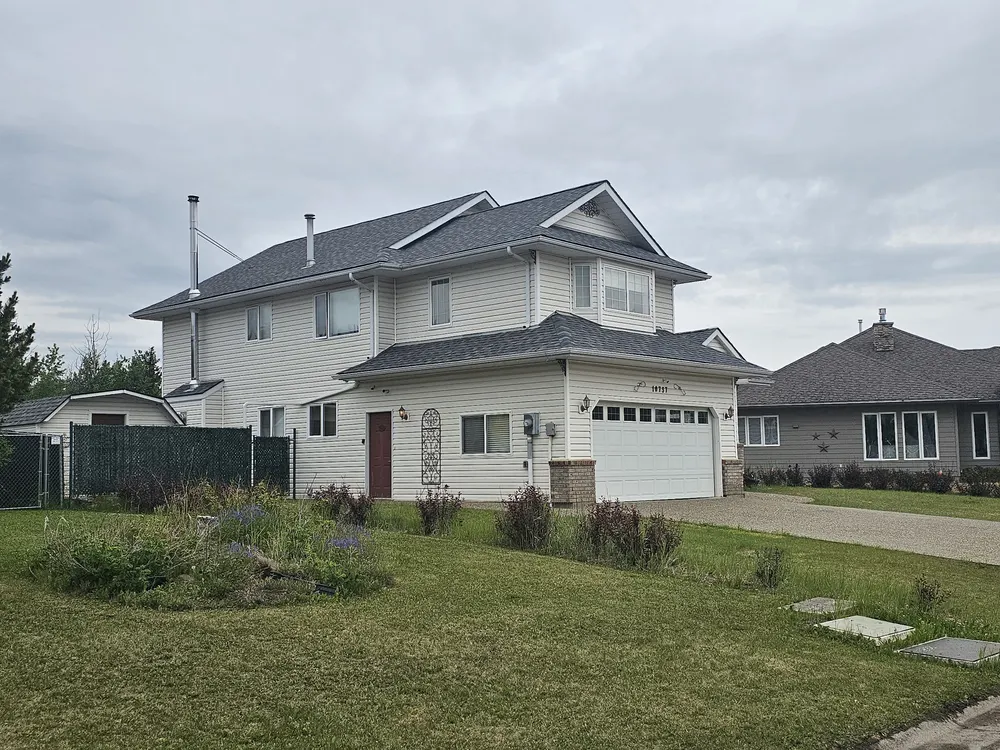 Finished shingle roof on a two-storey South Peace home